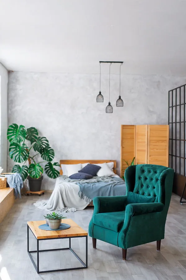 Bedroom decorated with coffee table and armchair