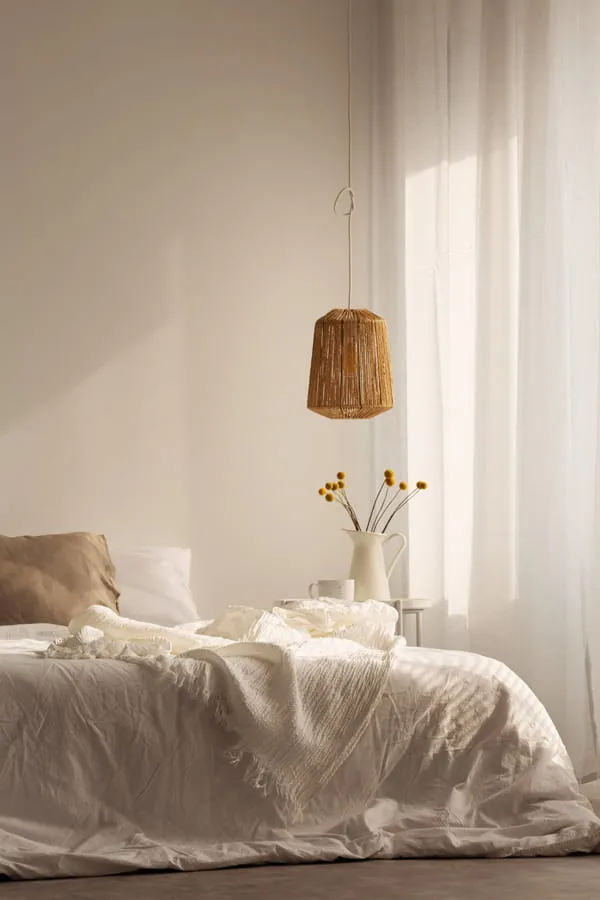 Bedroom decorated with white bedding