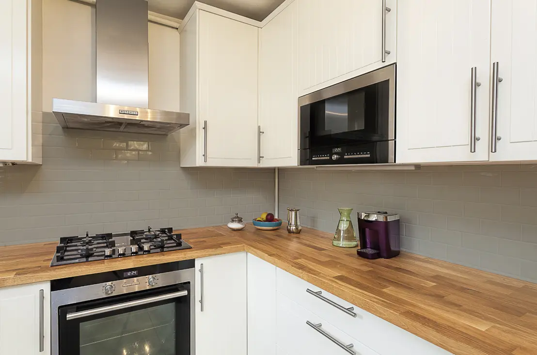 Before and after applying tile paint in kitchen